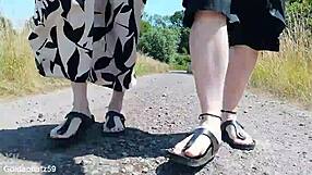 german mature walks barefoot in birkenstocks through public outdoor nature