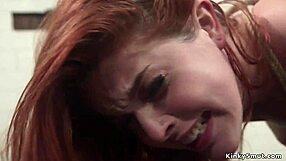 busty babe dominates bound redhead slave with strapon fucks whips and hardcore lesbian bdsm