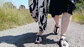 german mature walks barefoot in birkenstocks through public outdoor nature