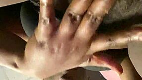 Ebony street hooker fingers her wet hairy pussy