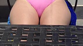 rubbing creamy sun lotion over her huge tits while flashing panties public beach