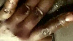 Ebony street hooker fingers her wet hairy pussy