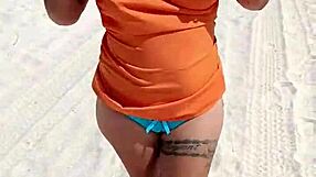 Mexican whore teases thong and tits on crowded beach