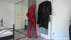 Red leather hooded mature wife bound in handcuffs chains