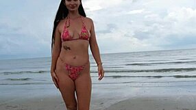 Cute petite brunette walks beach posing in sexy revealing bikini outdoors