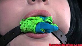 Inked sub chokes on toys while bound master dominates her roughly