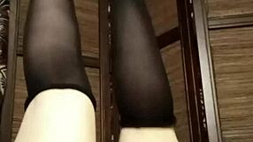 Petite girl teases in pantyhose and lingerie solo