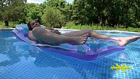 Hey, check out this wet granny flashing her shaved pussy by the pool.