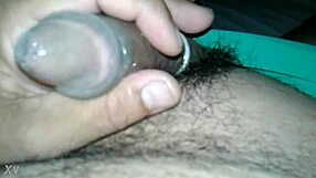 guy strokes his tiny condom-covered dick in solo session