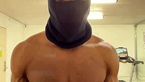 black bodybuilder works out neck and shoulders outdoors for college ladies