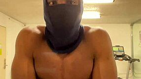 black bodybuilder works out neck and shoulders outdoors for college ladies