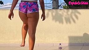 brunette hikes shorts into ass crack outdoors