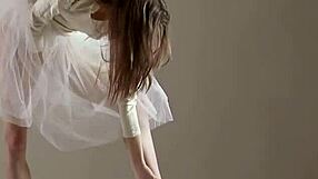 Blonde gymnast stretches flexibly through acrobatic gym poses