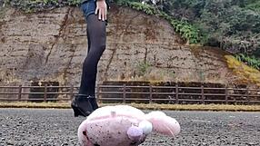 Japanese crossdresser crushes soft toys in fetish play revealing asian urges.