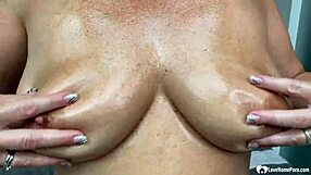 Milf next door strips teases big natural tits in heels and oil