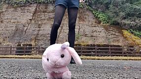 Japanese crossdresser crushes soft toys in fetish play revealing asian urges.