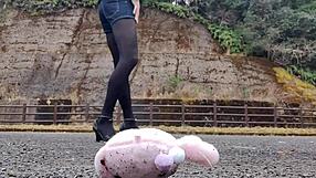 Japanese crossdresser crushes soft toys in fetish play revealing asian urges.