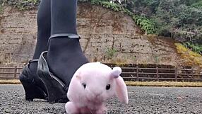 Japanese crossdresser crushes soft toys in fetish play revealing asian urges.