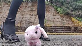 Japanese crossdresser crushes soft toys in fetish play revealing asian urges.