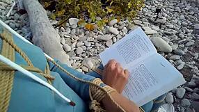 i'm sofi tied up against the sea reading my book in this hot pov view