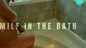 Milf boldly toys shaved pussy in hot bath
