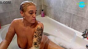 Milf boldly toys shaved pussy in hot bath