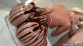 blonde big ass babe drizzles chocolate syrup over juicy booty cheeks