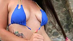 Pretty brunette in blue bikini dances flashes fingers beach publicly