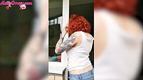 sexy redhead babe in wet t-shirt washes windows horny homemade