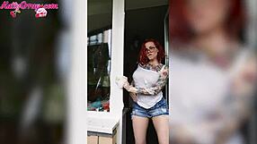 sexy redhead babe in wet t-shirt washes windows horny homemade