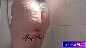 Curvy babe fingers wet pussy in steamy shower jet