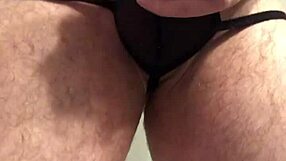 Black lingerie clings tight around her ass with buttplug teasing pussy closeup
