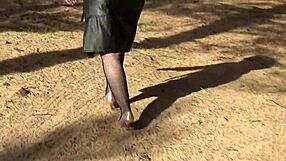 woman struts boldly in fishnet bodystocking and heels