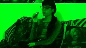 beth kinky goth domina lights up a cigarette in green light hd pt1
