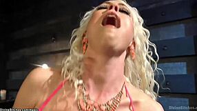 blonde femdom mistress chokes slave while riding cock with strapon domination