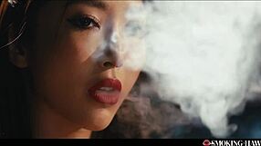 Japanese babe smokes cig dirty talks while exhaling on thick cock