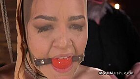 hogtied babe takes deep pussy fingering punishment.