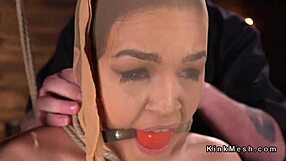 hogtied babe takes deep pussy fingering punishment.