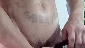 Huge tattooed cock throbs under dirty webcam stroke