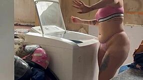 woman bares wet pussy and tits washing clothes outside