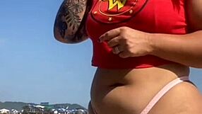 TATTOO FLASH LEADS TO PUSSY REVEAL ON BEACH!