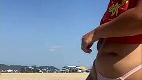 TATTOO FLASH LEADS TO PUSSY REVEAL ON BEACH!