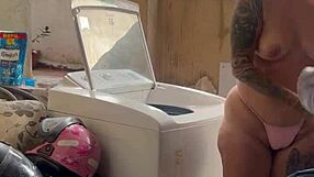 woman bares wet pussy and tits washing clothes outside