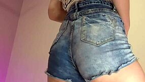 her tight denim shorts barely cover that skinny blonde's teasing ass as she shakes it in homemade striptease