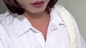 Asian shemale Ting Xuan pees outdoors as office lady