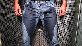 guy soaks jeans with piss then blasts cumshot outdoors