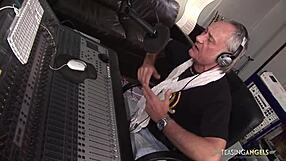 busty brunette babe hooks up with two music producers on the sofa she rides them hard in stockings