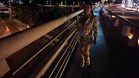 luscious curvy milf struts braless and pantyless across the bridge