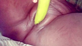 Desi bhabhi stuffs brinjal deep in shaved pussy for wet orgasm