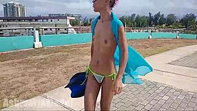 A daring hairy latina teen explores wet pussy thrills underwater by the pool.